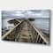 Designart - Wooden Pier on North Irish Coastline - Sea Bridge Canvas Art Print